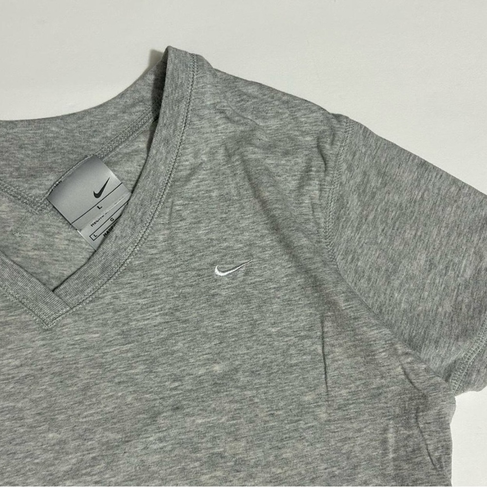 Nike women’s Size M/L Light Grey Tee w/ swoosh